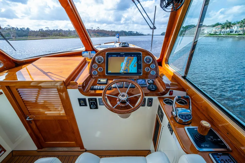 Slide: The Image of Helm of 2017 Hinckley Picnic Boat 37 MKIII with navigation system and wooden accents. - 14