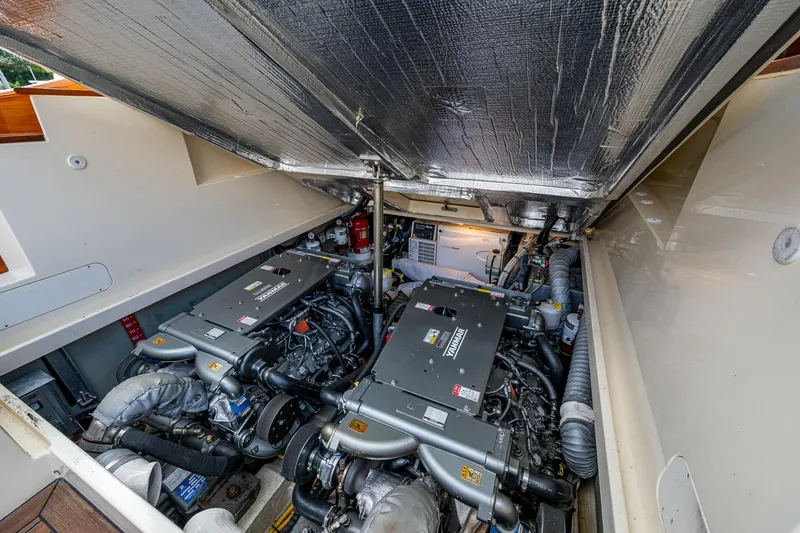 Slide: The Image of Engine room of 2017 Hinckley Picnic Boat 37 MKIII, showcasing dual engines and mechanical components. - 26