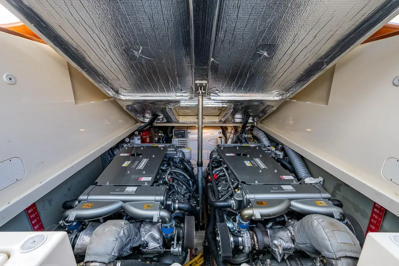 Slide: The Image of Engine compartment of a 2017 Hinckley Picnic Boat 37 MKIII, showcasing dual engines. - 27