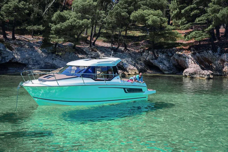 Slide: The Image of 2025 Jeanneau NC 795 Series 2 boat cruising on open water. - 4