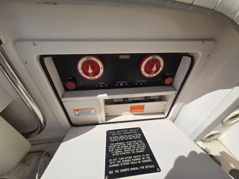 Slide: The Image of Control panel of a 2005 Grady-White 330 Express boat, featuring gauges and switches. - 7