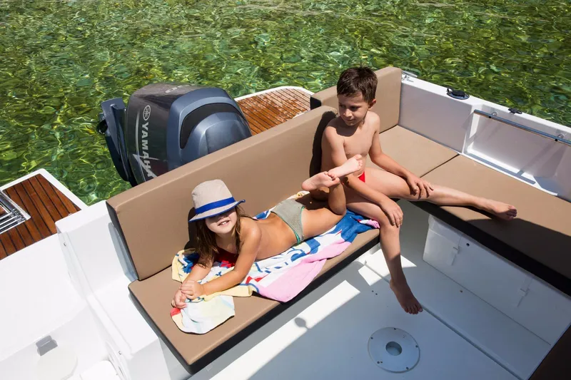 Slide: The Image of 2025 Jeanneau NC 795 Series 2 cruising on open water, showcasing sleek design and performance. - 6