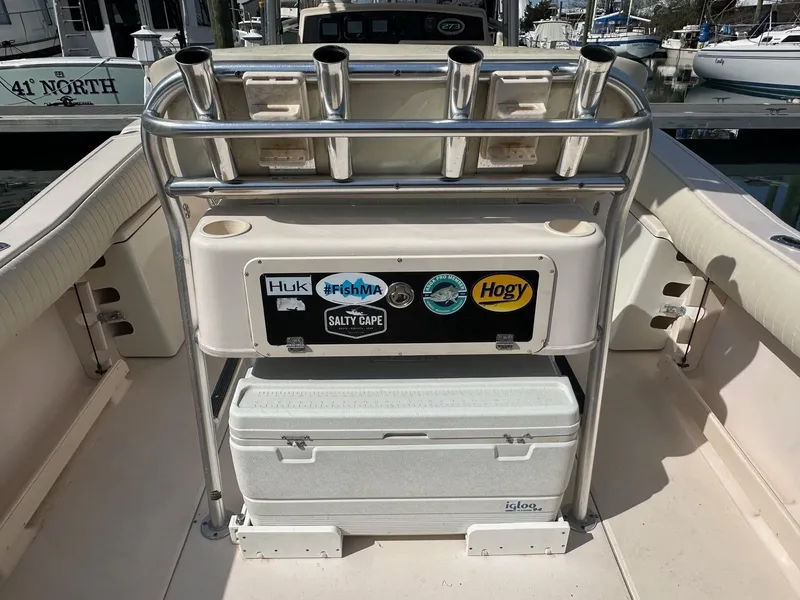 Slide: The Image of 2007 Grady-White 273 CHASE boat with rod holders and cooler on deck. - 14