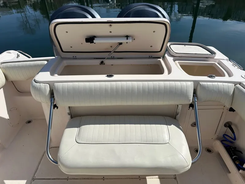 Slide: The Image of 2007 Grady-White 273 CHASE boat interior with seating and storage compartments. - 15