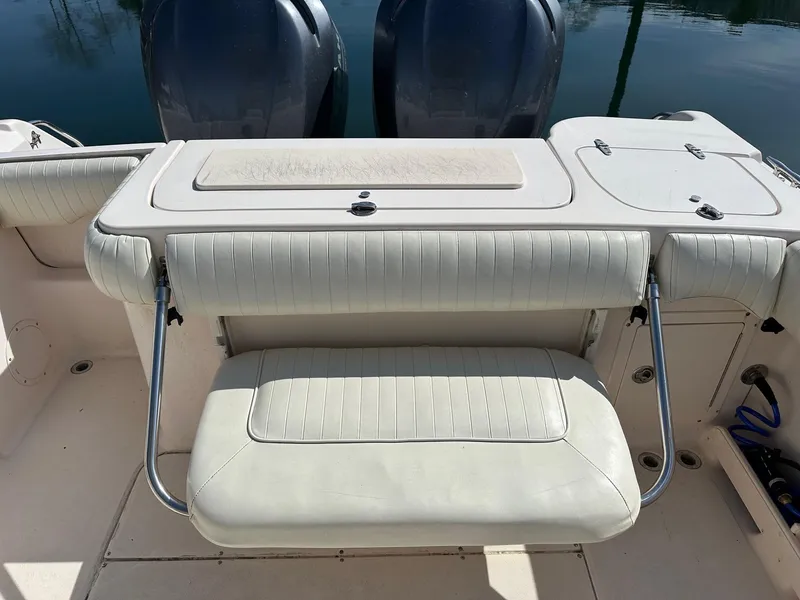 Slide: The Image of 2007 Grady-White 273 CHASE boat with dual engines and cushioned seating. - 16