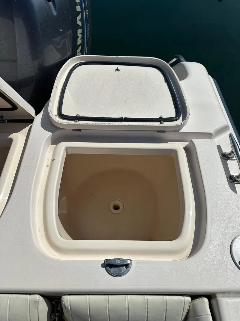 Slide: The Image of 2007 Grady-White 273 CHASE boat livewell with open lid, showing interior. - 18