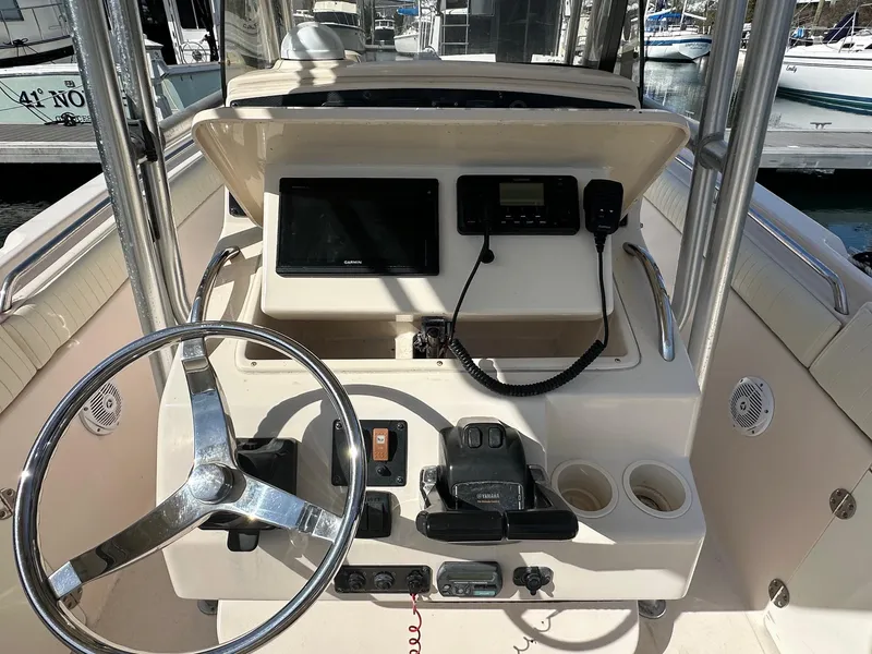 Slide: The Image of 2007 Grady-White 273 CHASE boat console with steering wheel and navigation equipment. - 4