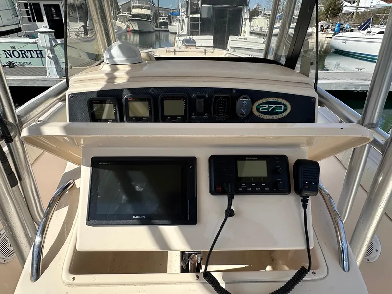 Slide: The Image of 2007 Grady-White 273 CHASE boat dashboard with navigation and communication equipment. - 5