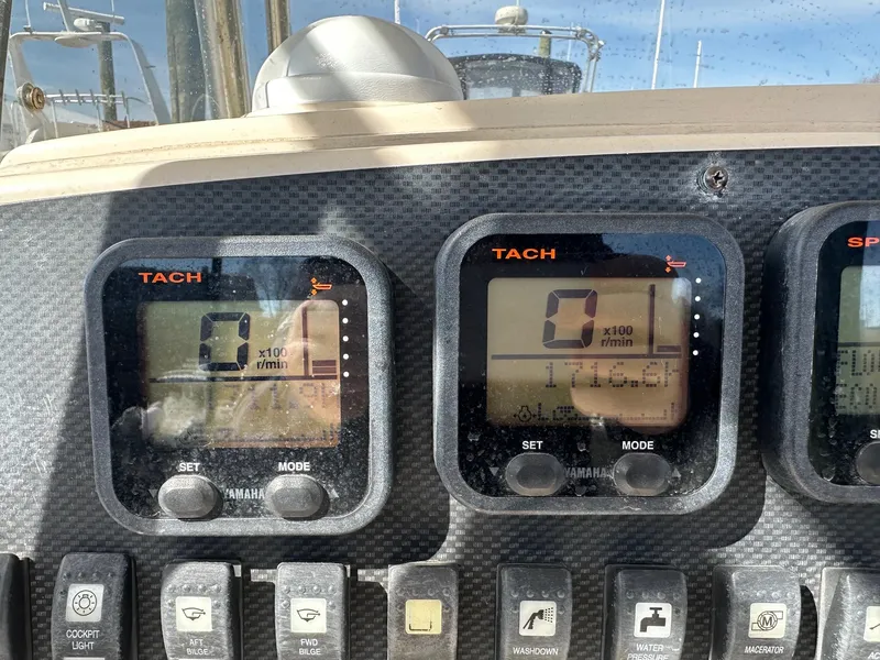 Slide: The Image of Dashboard of a 2007 Grady-White 273 CHASE boat with tachometer displays. - 7
