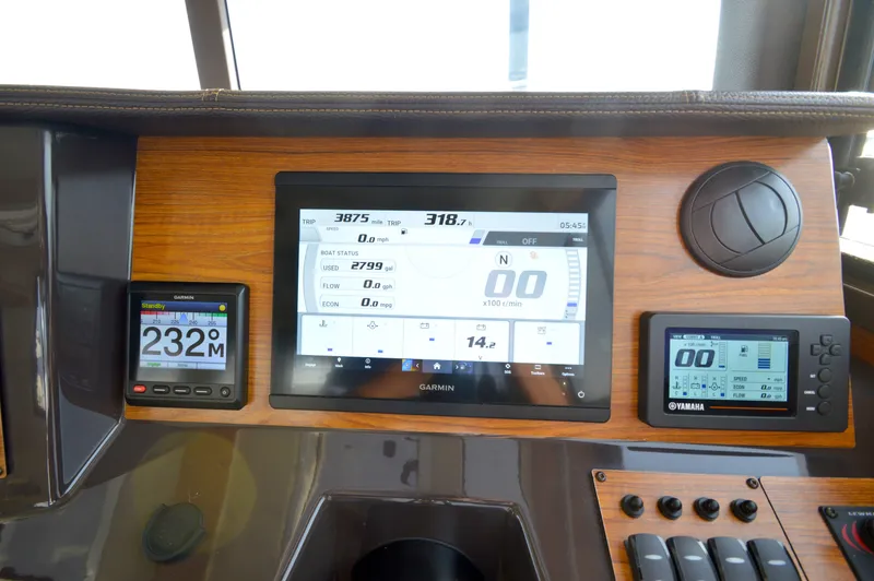 Slide: The Image of Dashboard of a 2020 Ranger Tugs R-27 with Garmin and Yamaha displays. - 36