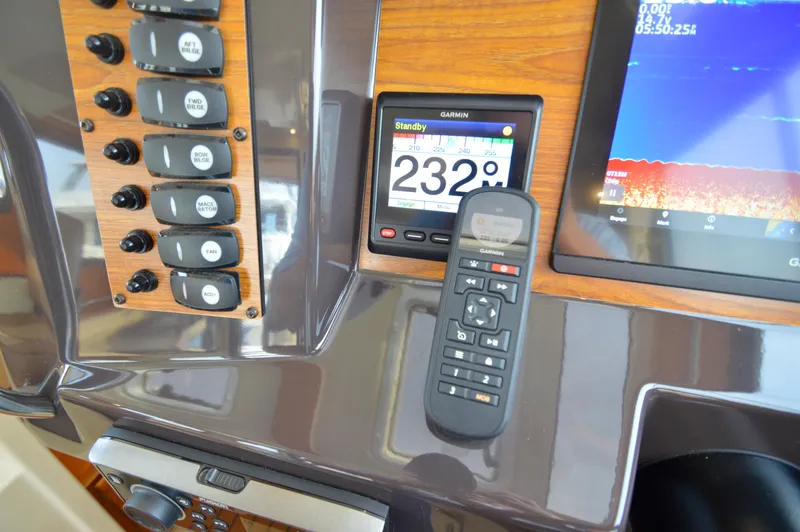 Slide: The Image of 2020 Ranger Tugs R-27 dashboard with Garmin navigation and control panel. - 37