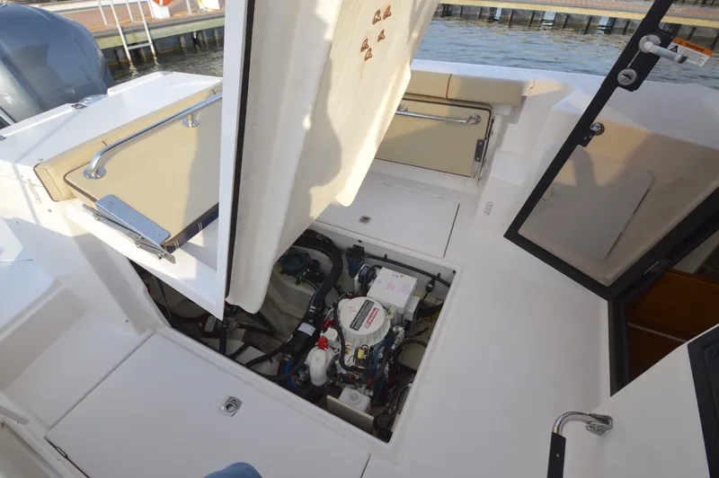 Slide: The Image of 2020 Ranger Tugs R-27 boat engine compartment with open access panels. - 41