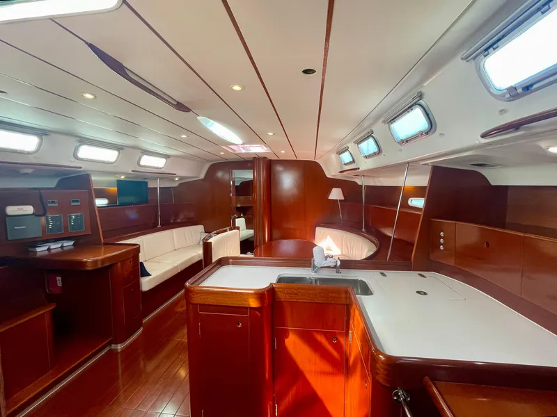 Slide: The Image of Luxurious interior of 2002 Beneteau First 47.7 yacht with elegant wood finish and modern amenities. - 18