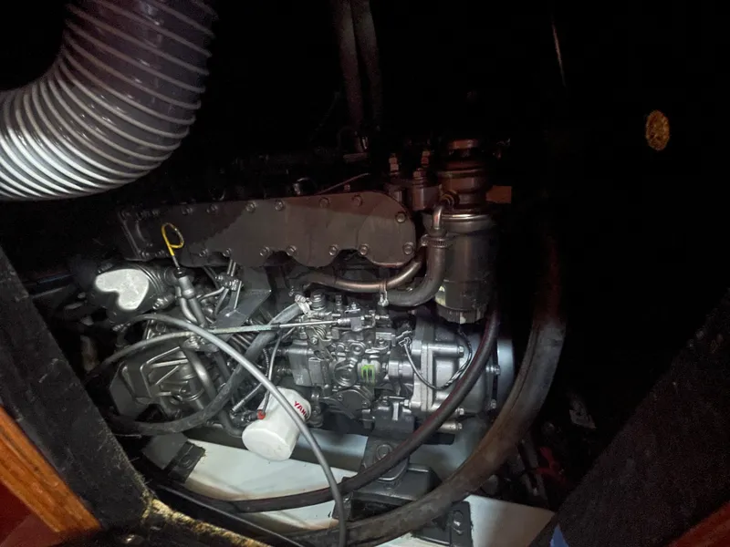 Slide: The Image of Engine compartment of a 2002 Beneteau First 47.7 sailboat, showcasing mechanical components. - 42