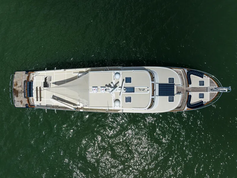 Slide: The Image of Aerial view of 2011 Marlow 97 Explorer yacht on green water. - 10