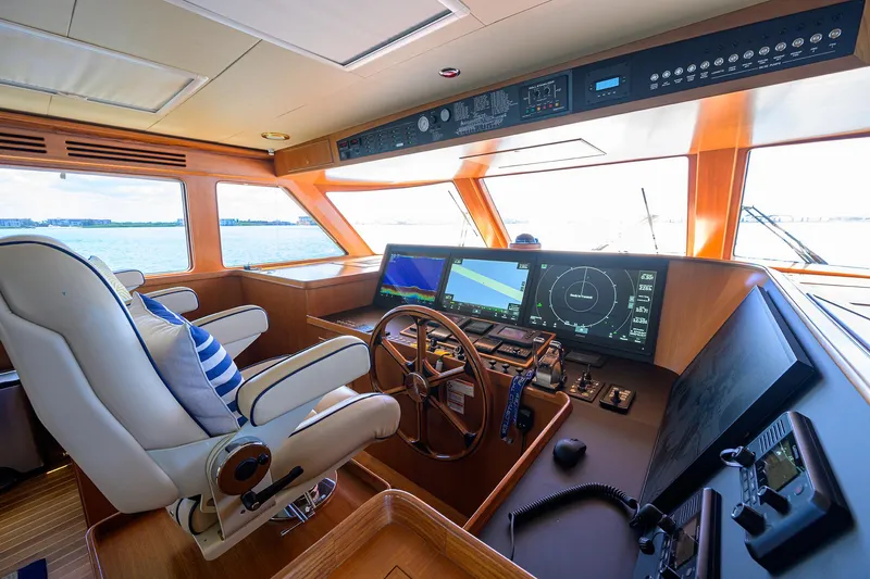 Slide: The Image of Pilothouse of 2011 Marlow 97 Explorer yacht with navigation equipment and captain's chair. - 2