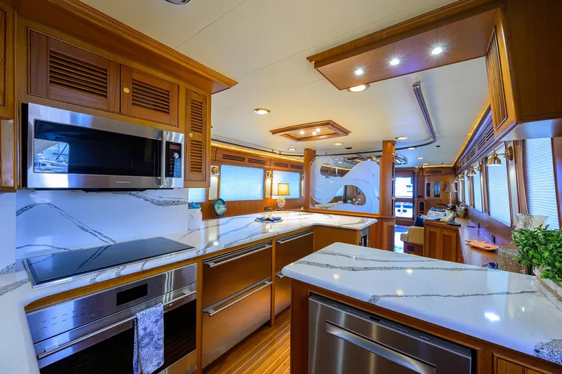 Slide: The Image of Luxurious kitchen interior of 2011 Marlow 97 Explorer yacht with modern appliances and elegant design. - 21