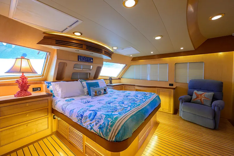 Slide: The Image of Luxurious bedroom interior of 2011 Marlow 97 Explorer yacht with cozy bedding and elegant lighting. - 24