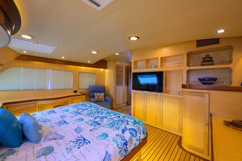 Slide: The Image of Luxurious cabin interior of 2011 Marlow 97 Explorer yacht with cozy bed and modern amenities. - 25