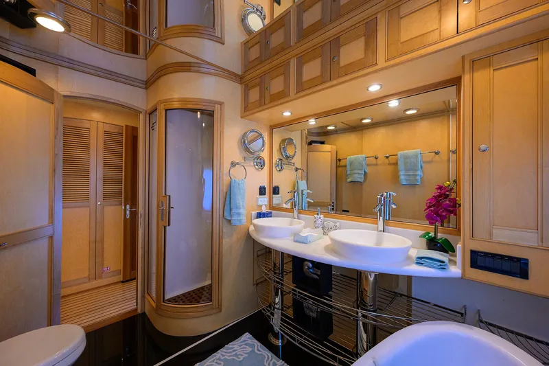 Slide: The Image of Luxurious bathroom in 2011 Marlow 97 Explorer yacht with dual sinks and modern fixtures. - 27