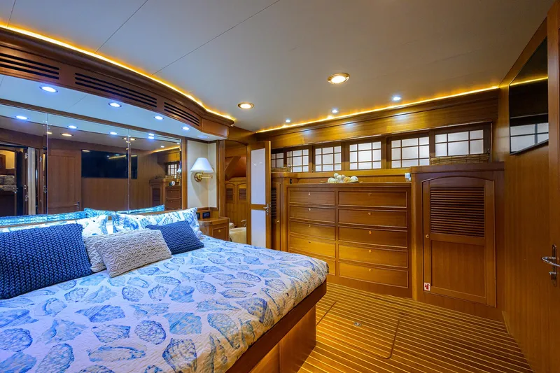 Slide: The Image of Luxurious bedroom interior of 2011 Marlow 97 Explorer yacht with elegant wood finishes. - 31