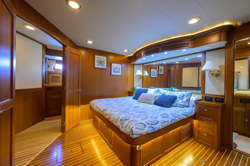 Slide: The Image of Luxurious cabin interior of 2011 Marlow 97 Explorer yacht with elegant wood finish. - 32