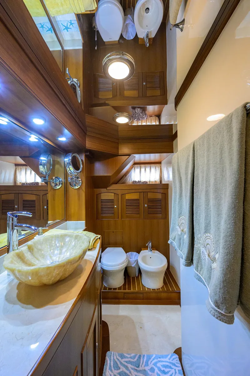 Slide: The Image of Luxurious Marlow 97 Explorer 2011 yacht bathroom with elegant wood finishes and modern fixtures. - 35