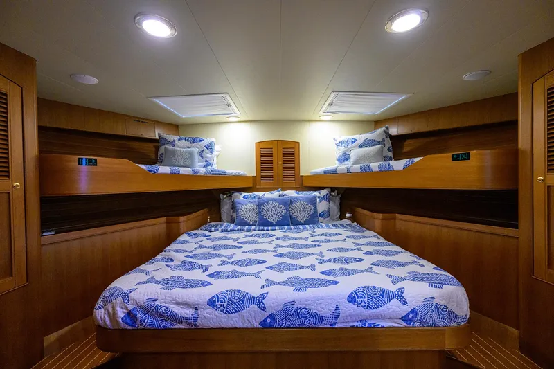 Slide: The Image of Luxurious cabin interior of 2011 Marlow 97 Explorer yacht with fish-patterned bedding. - 36