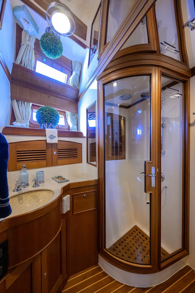 Slide: The Image of Luxurious Marlow 97 Explorer 2011 yacht bathroom with wood accents and modern shower. - 39