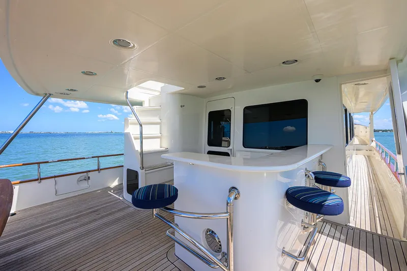 Slide: The Image of Luxury yacht deck with bar seating, Marlow 97 Explorer, 2011 model, ocean view. - 4