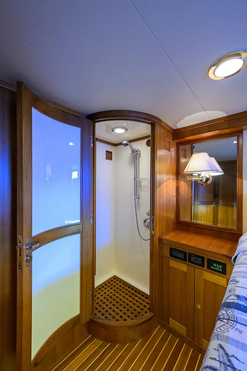 Slide: The Image of Luxurious Marlow 97 Explorer 2011 yacht interior with elegant wooden shower and cozy lighting. - 42