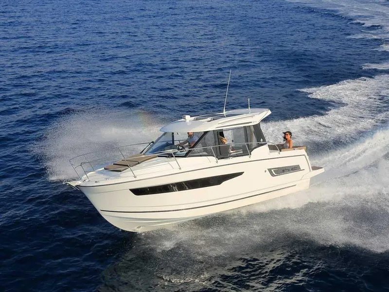 Slide: The Image of 2024 Jeanneau NC 895 cruising on open water, showcasing sleek design and performance. - 3