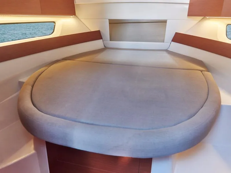 Slide: The Image of 2024 Jeanneau NC 895 cabin interior with cozy bed and modern design. - 18
