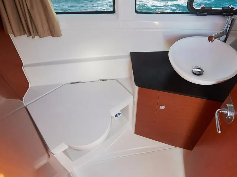 Slide: The Image of 2024 Jeanneau NC 895 boat bathroom with modern sink and toilet. - 19