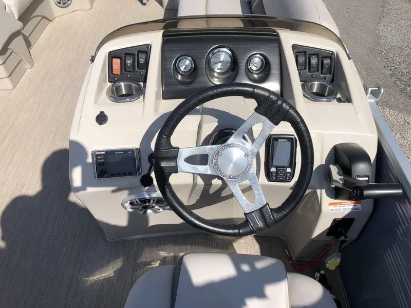 Slide: The Image of 2018 Bennington 22SLX boat dashboard with steering wheel and control panel. - 5