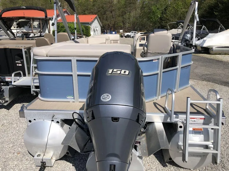 Slide: The Image of 2018 Bennington 22SLX pontoon boat with 150 HP engine, docked outdoors. - 8