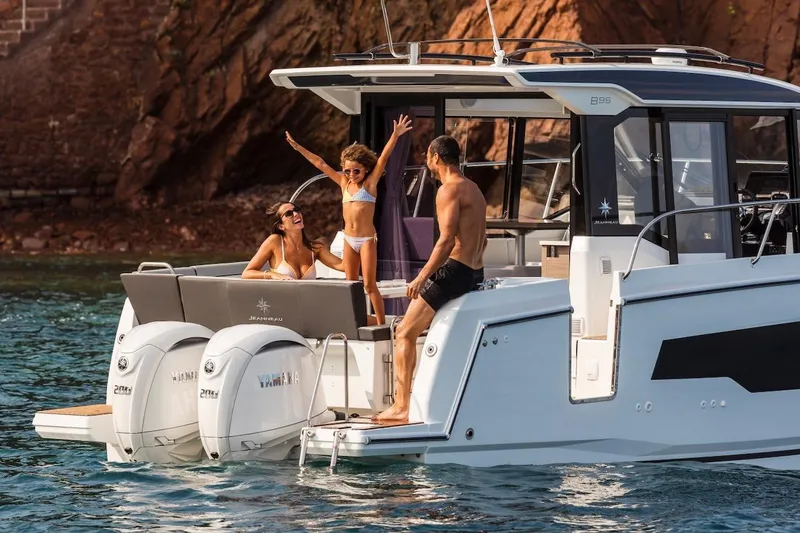 Slide: The Image of Family enjoying a day on the 2025 Jeanneau NC 895 Series 2 boat. - 27