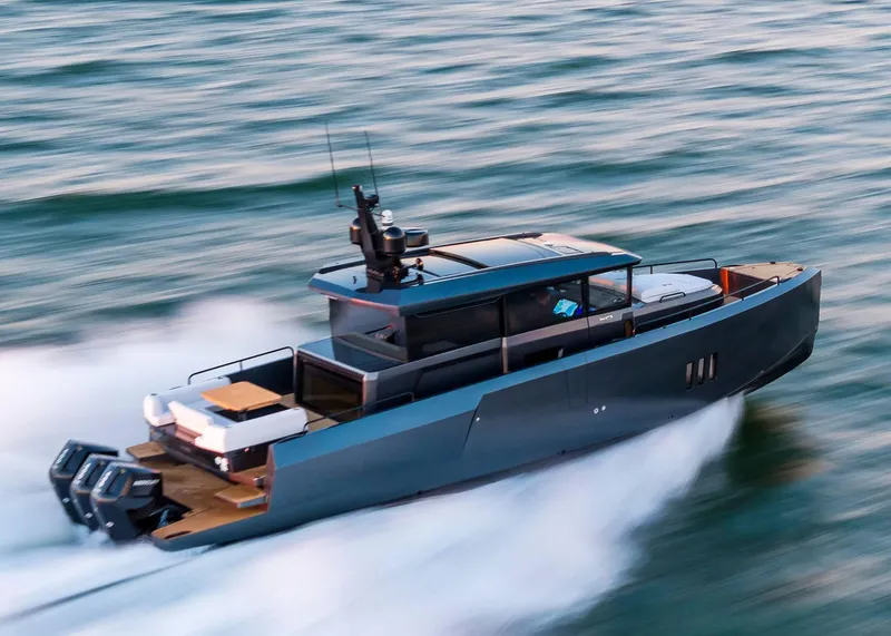 Slide: The Image of 2025 XO Boats EXPLR 44 speeding on water, showcasing sleek design and powerful engines. - 11