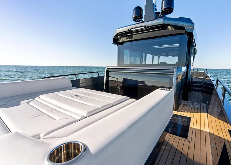 Slide: The Image of 2025 XO Boats EXPLR 44 luxury yacht with spacious deck and modern design on open water. - 14