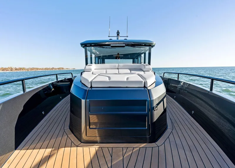 Slide: The Image of 2025 XO Boats EXPLR 44 yacht with sleek design on open water. - 18