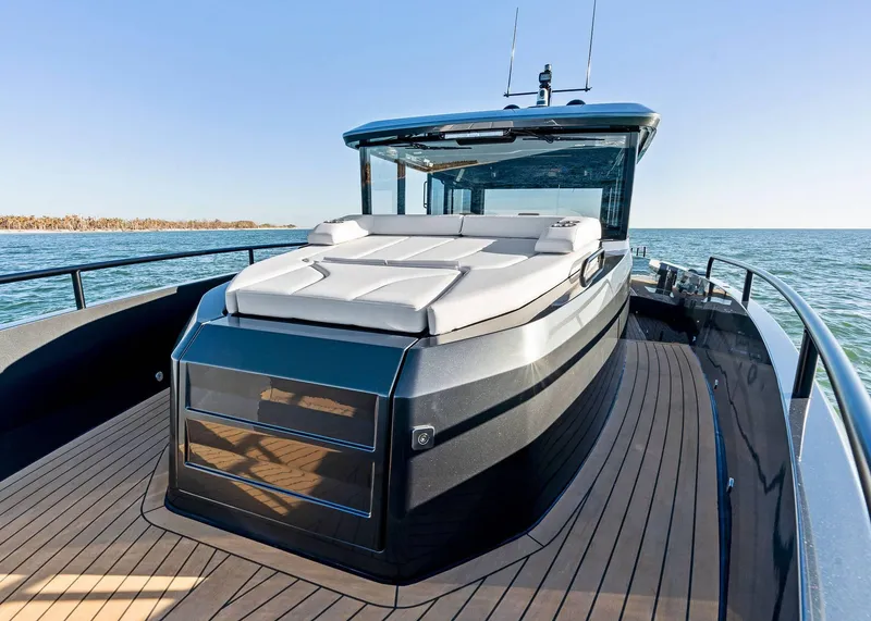 Slide: The Image of 2025 XO Boats EXPLR 44 yacht with sleek design and spacious deck on open water. - 19