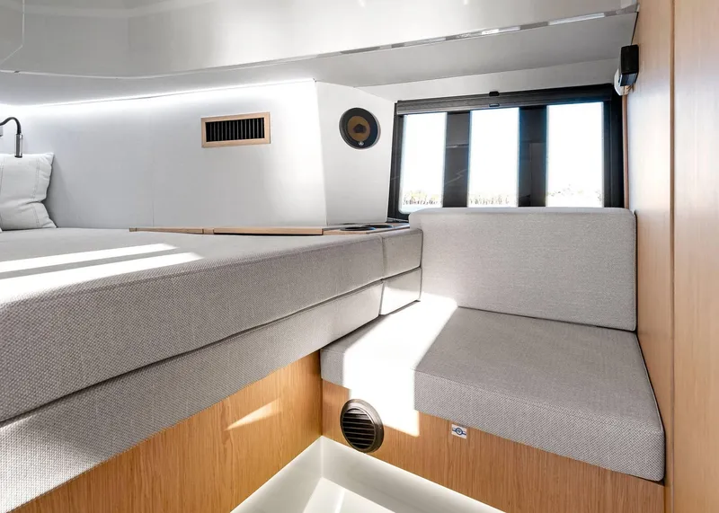 Slide: The Image of 2025 XO Boats EXPLR 44 interior with modern seating and natural light. - 37