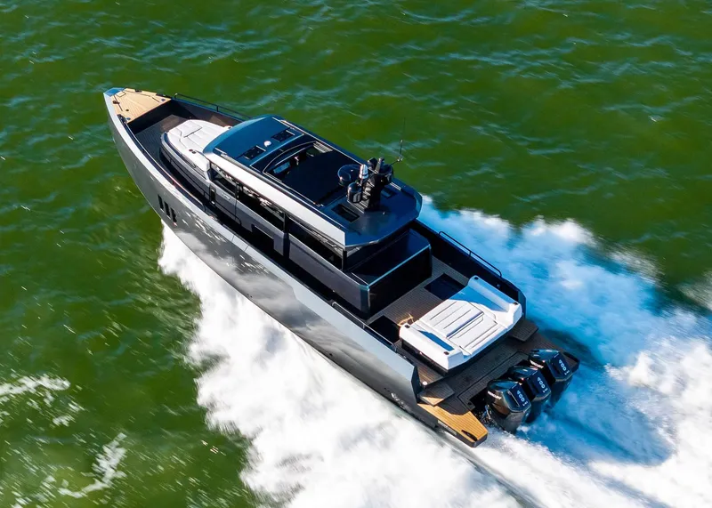 Slide: The Image of 2025 XO Boats EXPLR 44 cruising on open water, showcasing sleek design and powerful engines. - 4