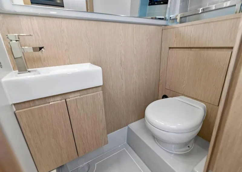 Slide: The Image of Modern bathroom in 2025 XO Boats EXPLR 44, featuring sleek sink and toilet. - 41