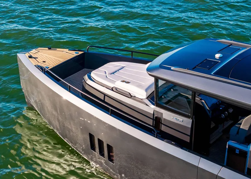 Slide: The Image of 2025 XO Boats EXPLR 44 cruising on water, showcasing sleek design and modern features. - 7