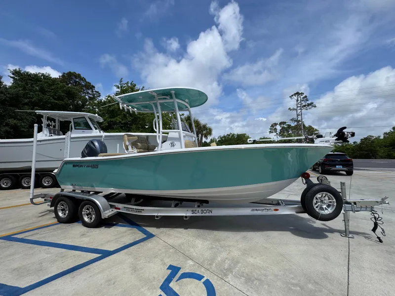 Slide: The Image of 2023 Sportsman Open 212 Center Console boat on trailer, parked outdoors. - 10