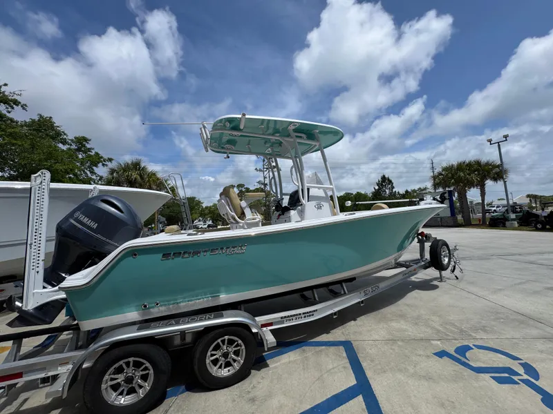 Slide: The Image of 2023 Sportsman Open 212 Center Console boat on trailer under blue sky. - 12