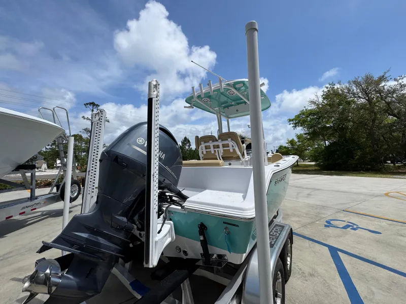 Slide: The Image of 2023 Sportsman Open 212 Center Console boat on trailer, featuring Yamaha outboard motor. - 14