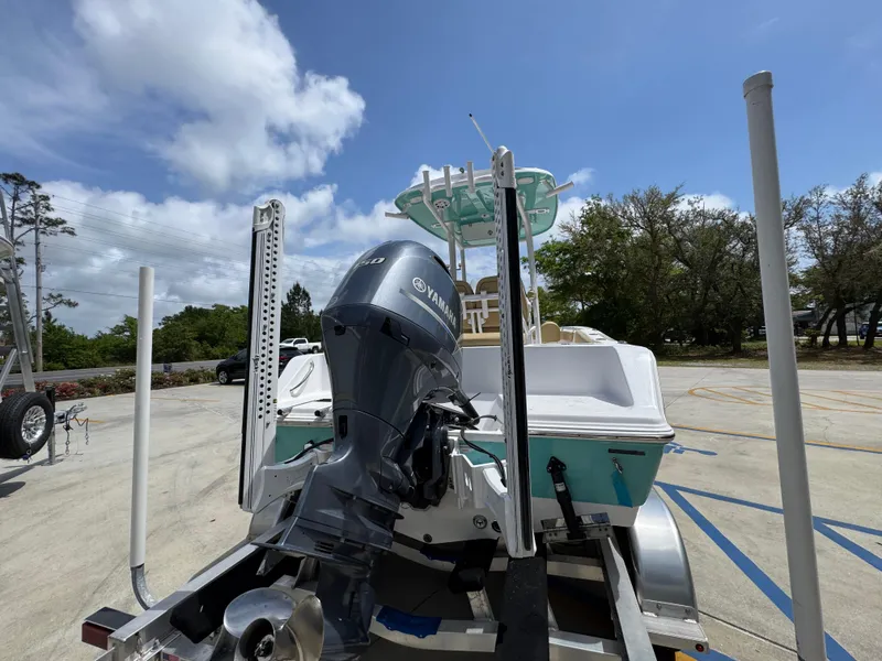 Slide: The Image of 2023 Sportsman Open 212 Center Console boat on trailer, featuring Yamaha outboard motor. - 15