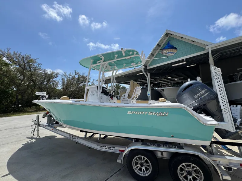 Slide: The Image of 2023 Sportsman Open 212 Center Console boat on trailer under blue sky. - 20